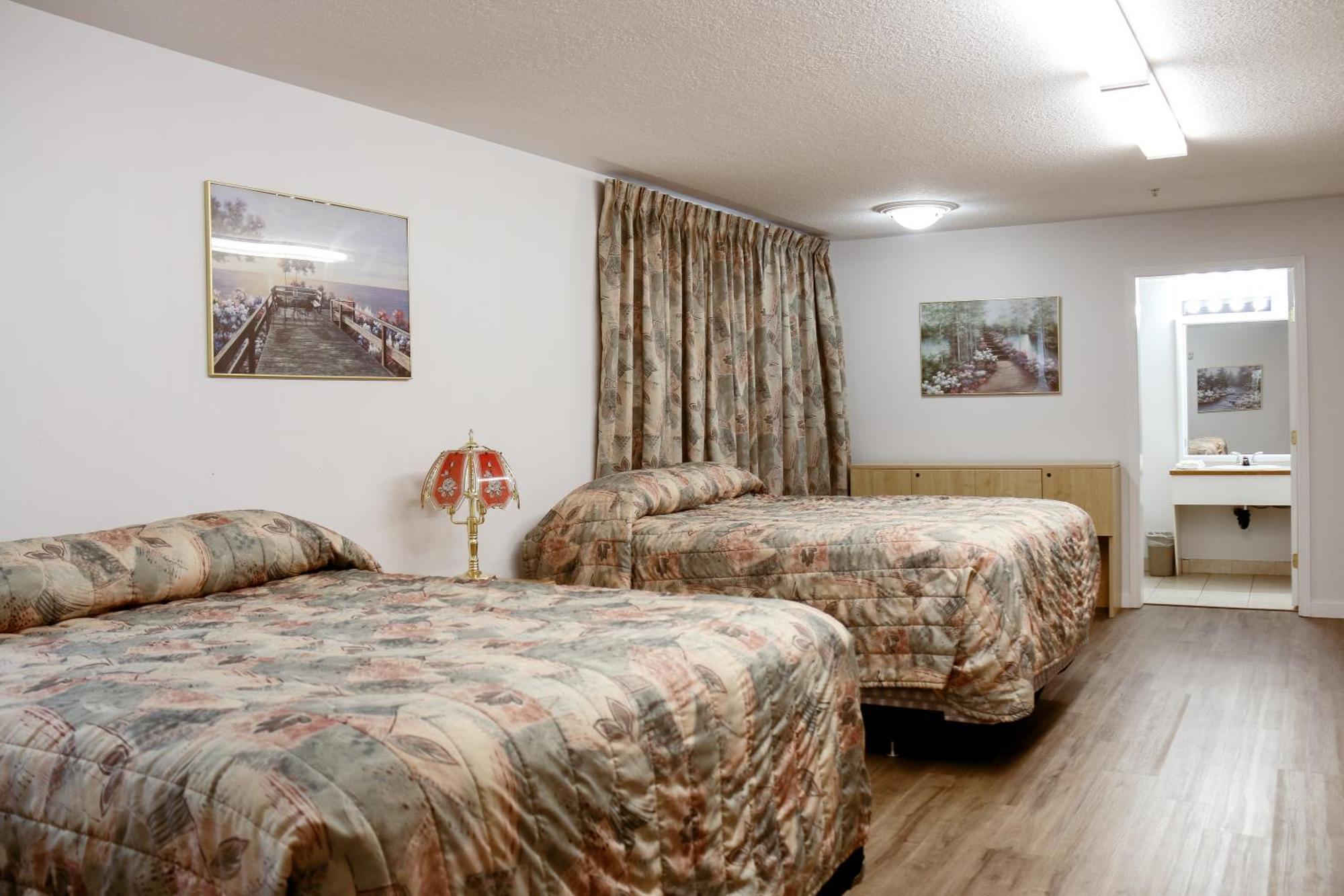 Western Budget Plus Mosaic Suites Penhold Exteriér fotografie